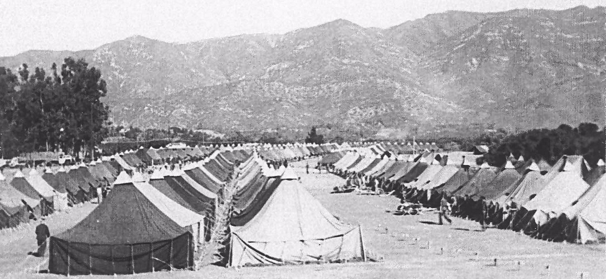 a group of tents in a field