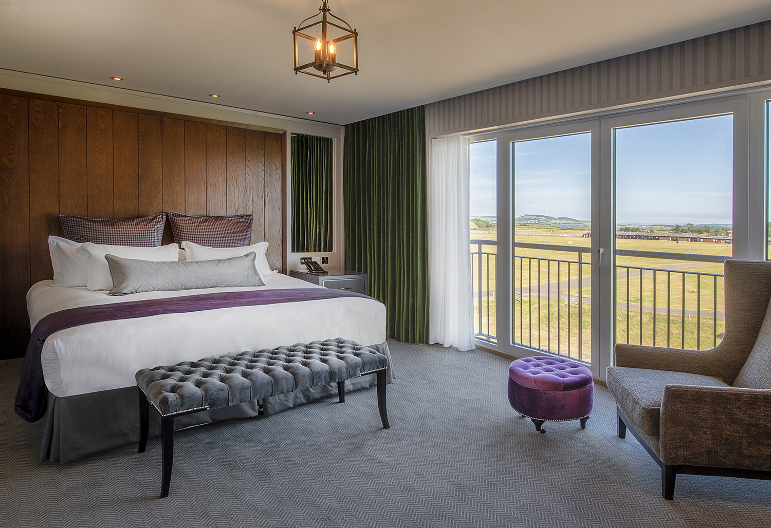 a bedroom with a large bed and a large window