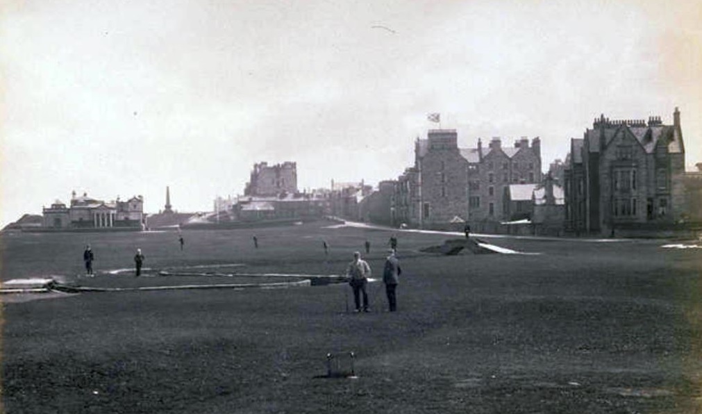a group of people standing in a field