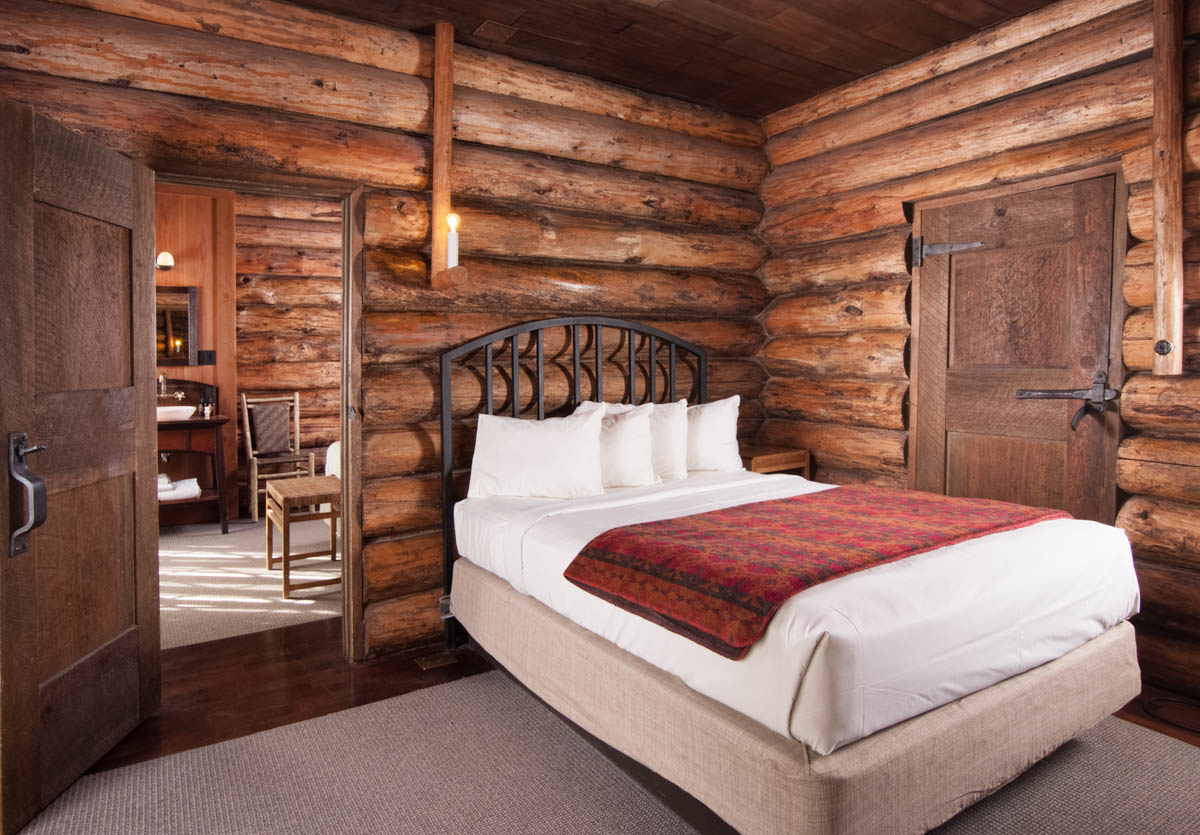 image of guestroom with log walls and suite old faithful inn yellowstone national park wyoming_high