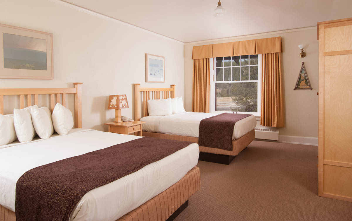 image of guestroom with two beds old faithful inn yellowstone national park wyoming_high