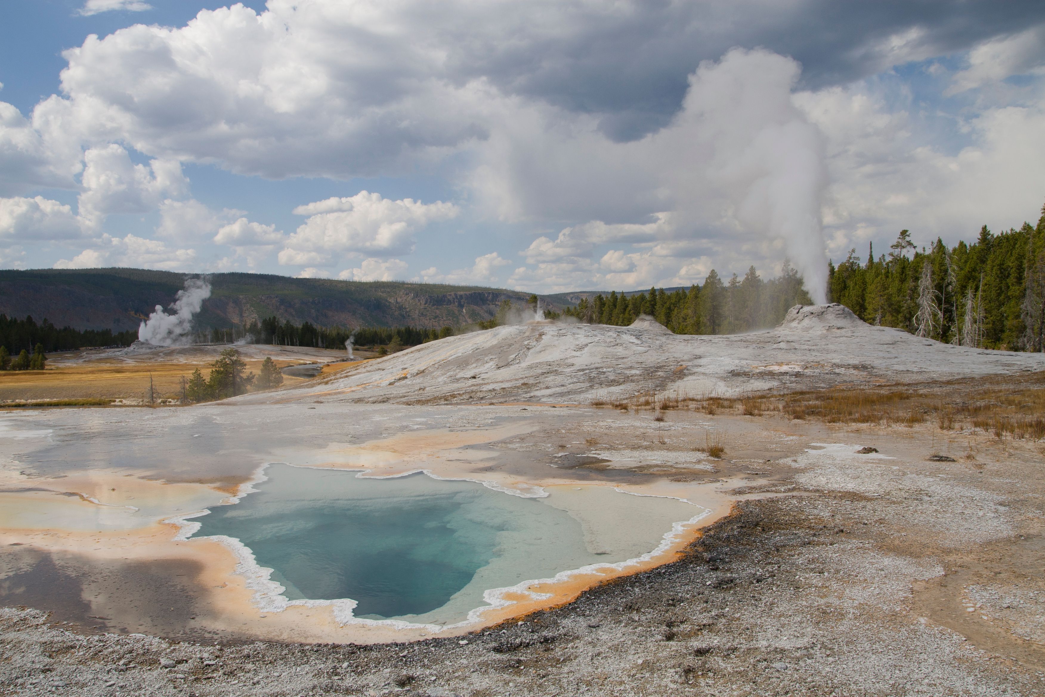image of old faithful erupting old faithful inn yellowstone national park wyoming_high