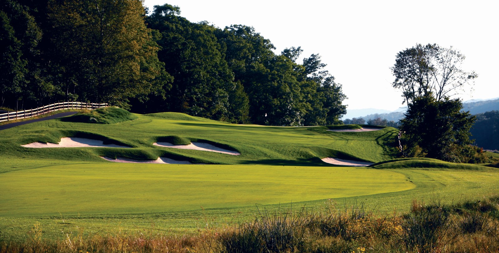 a golf course with sand bunkers