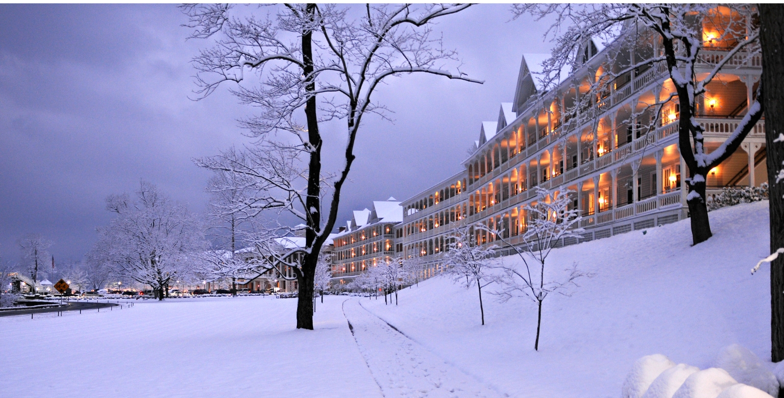 a building with lights on it in the snow