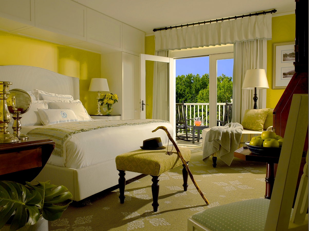 a bedroom with a bed and a chair