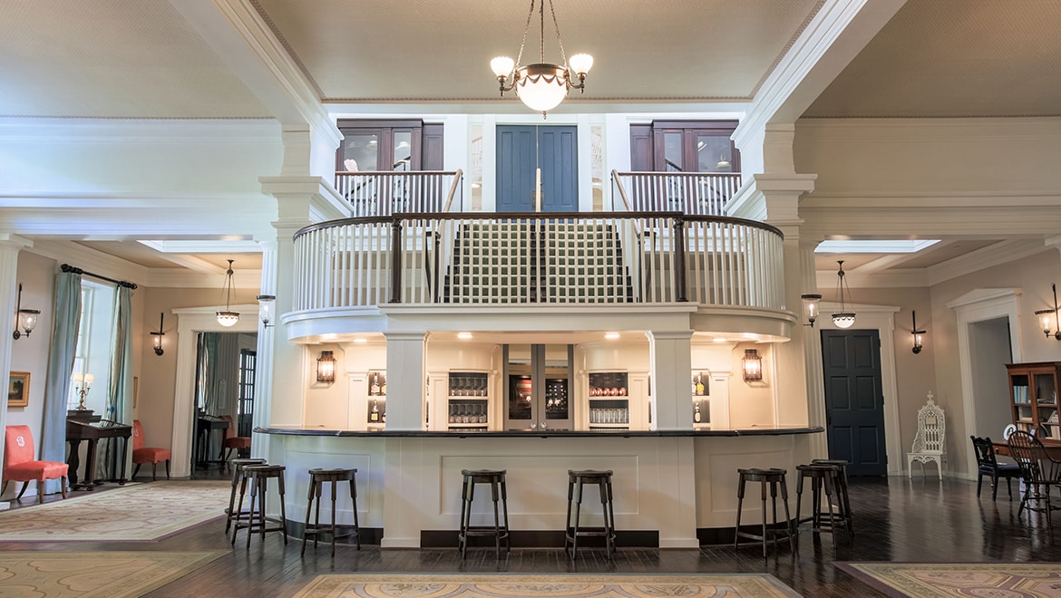 a bar with stools in a room