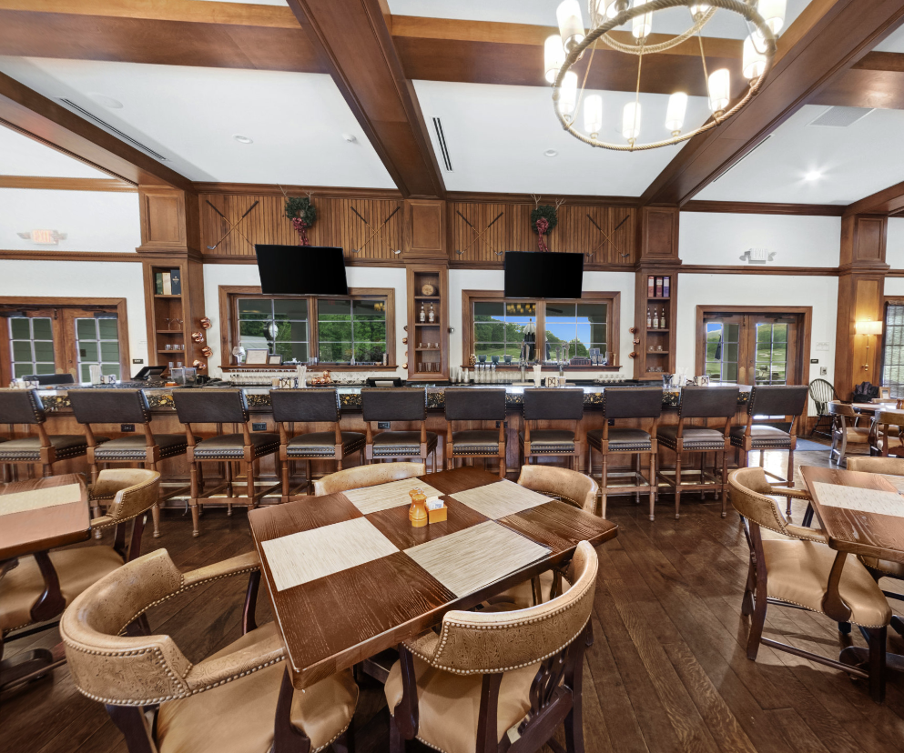 a room with a large table and chairs