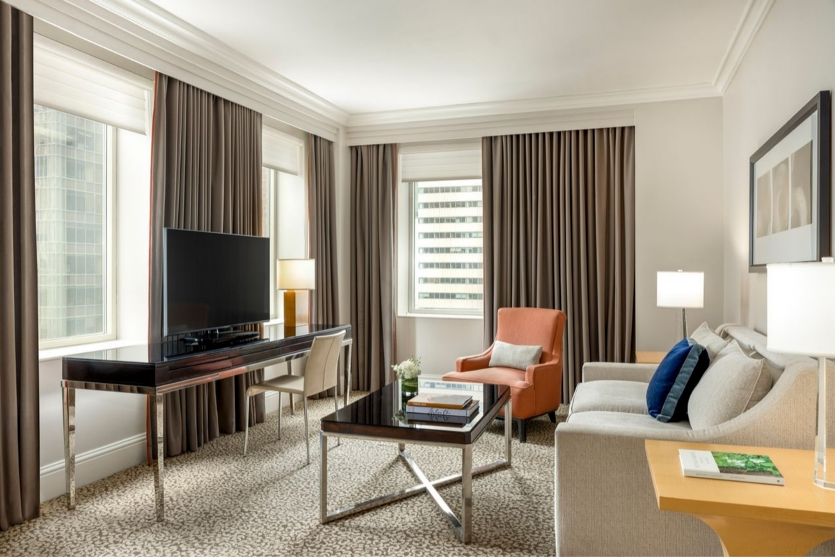 a living room with a television and a table