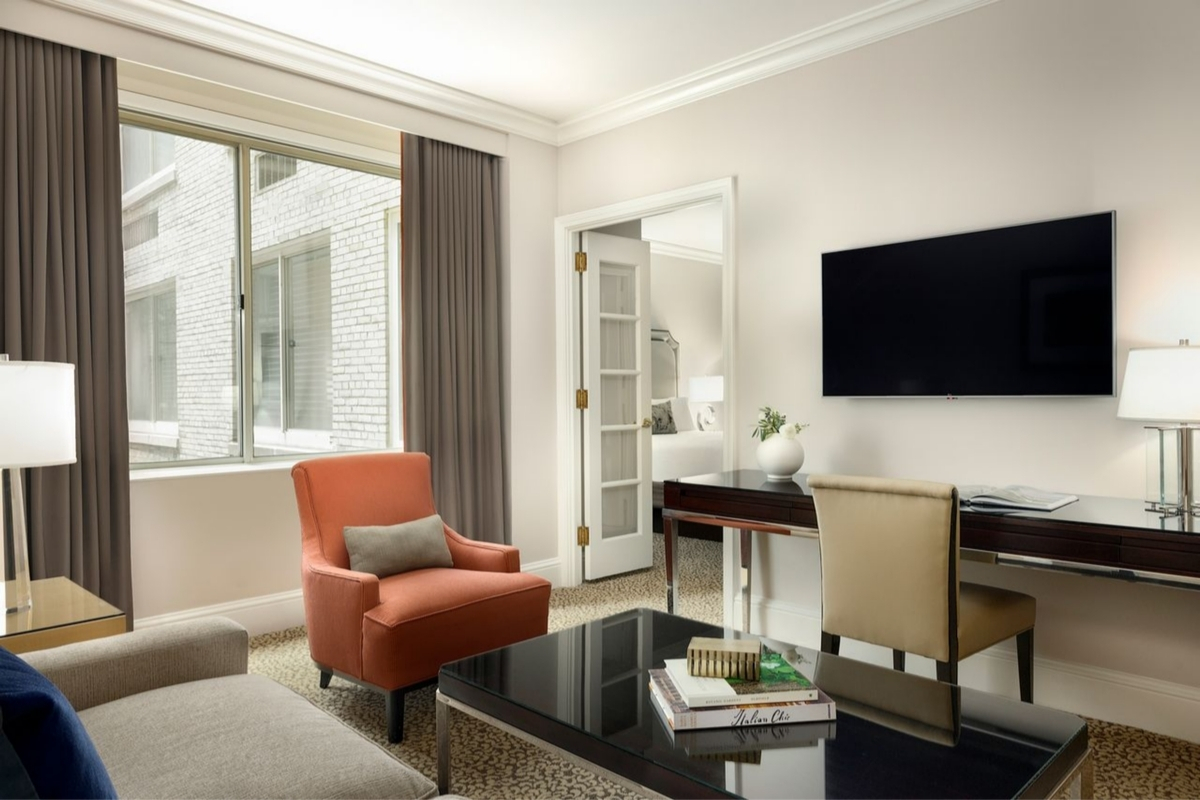a living room with a tv and a table