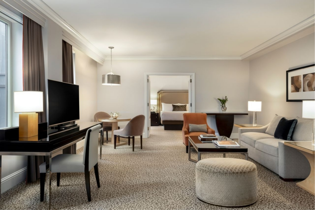 a room with a television and a bed
