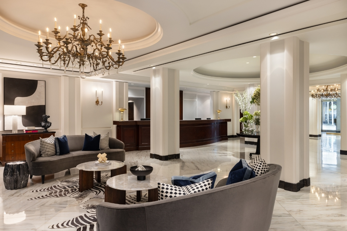 a lobby with a chandelier and couches