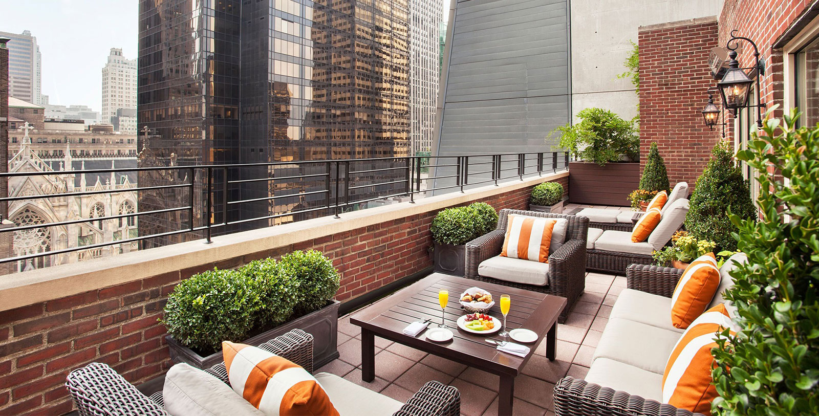 a table and chairs on a rooftop patio