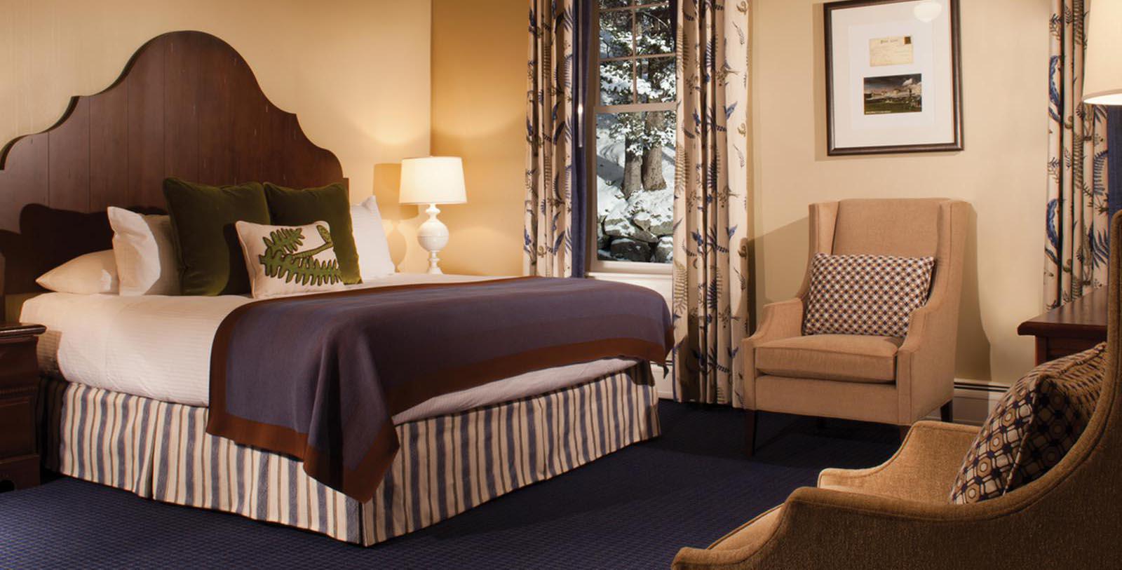 a room with a bed and chair