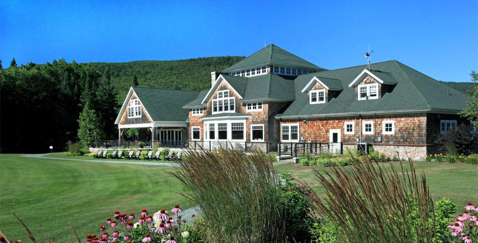 a large house with lawn and lawn