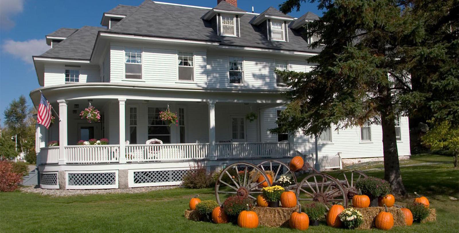 a house with pumpkins in front of it