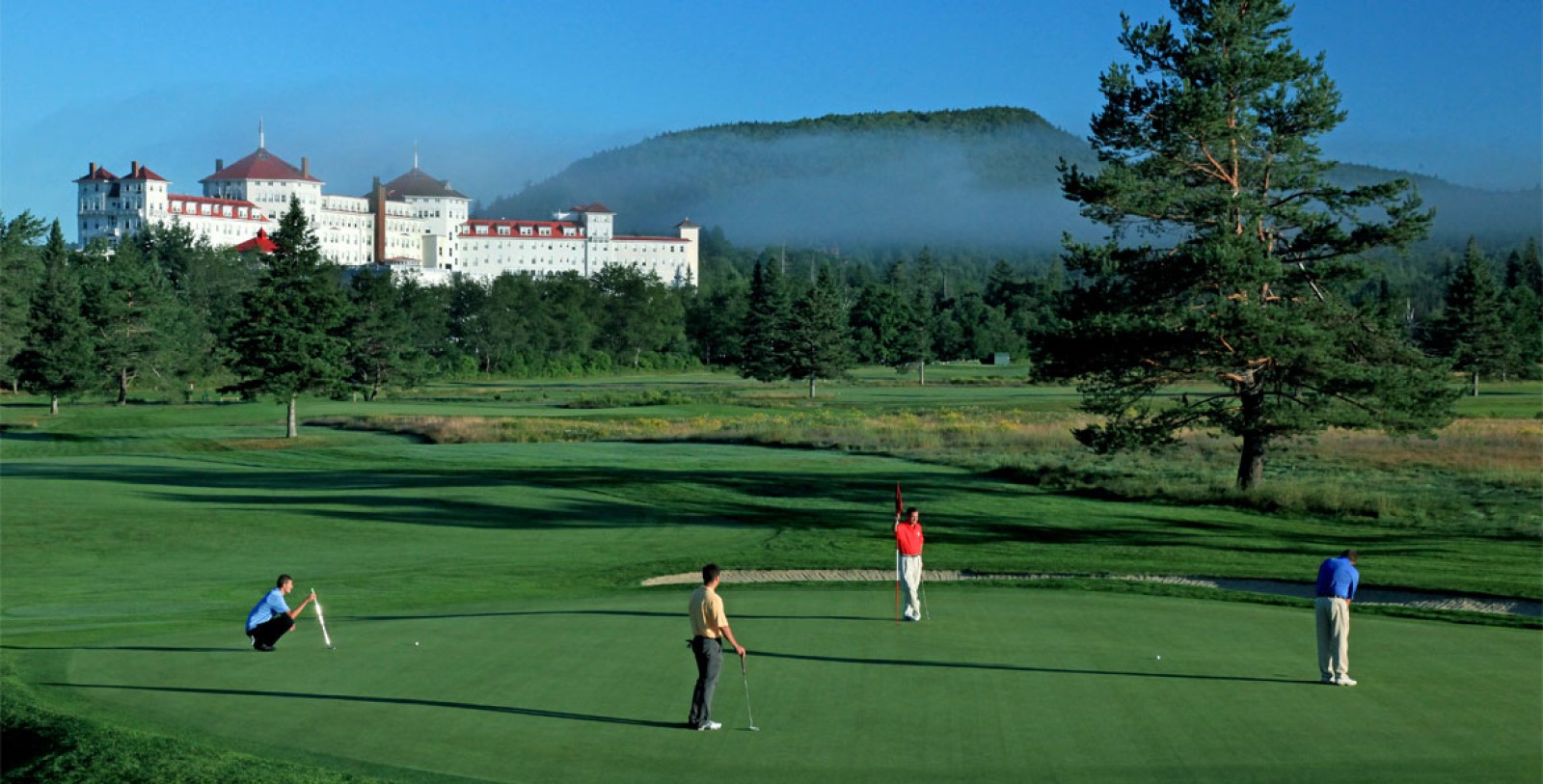 a group of men playing golf