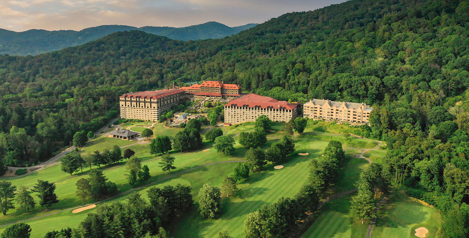 a large building surrounded by trees