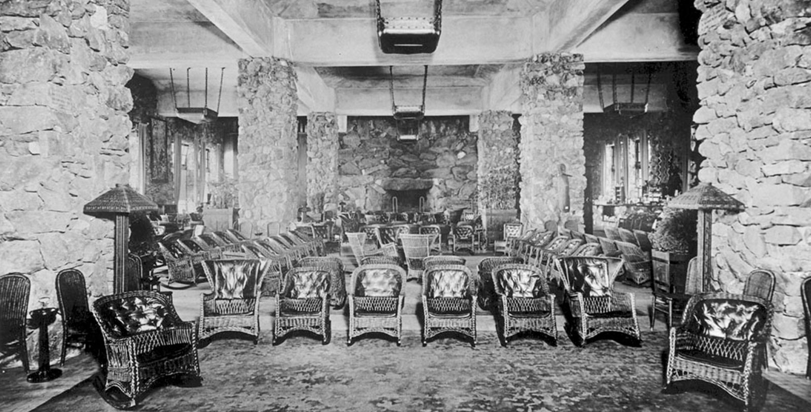 a room with chairs and a fireplace