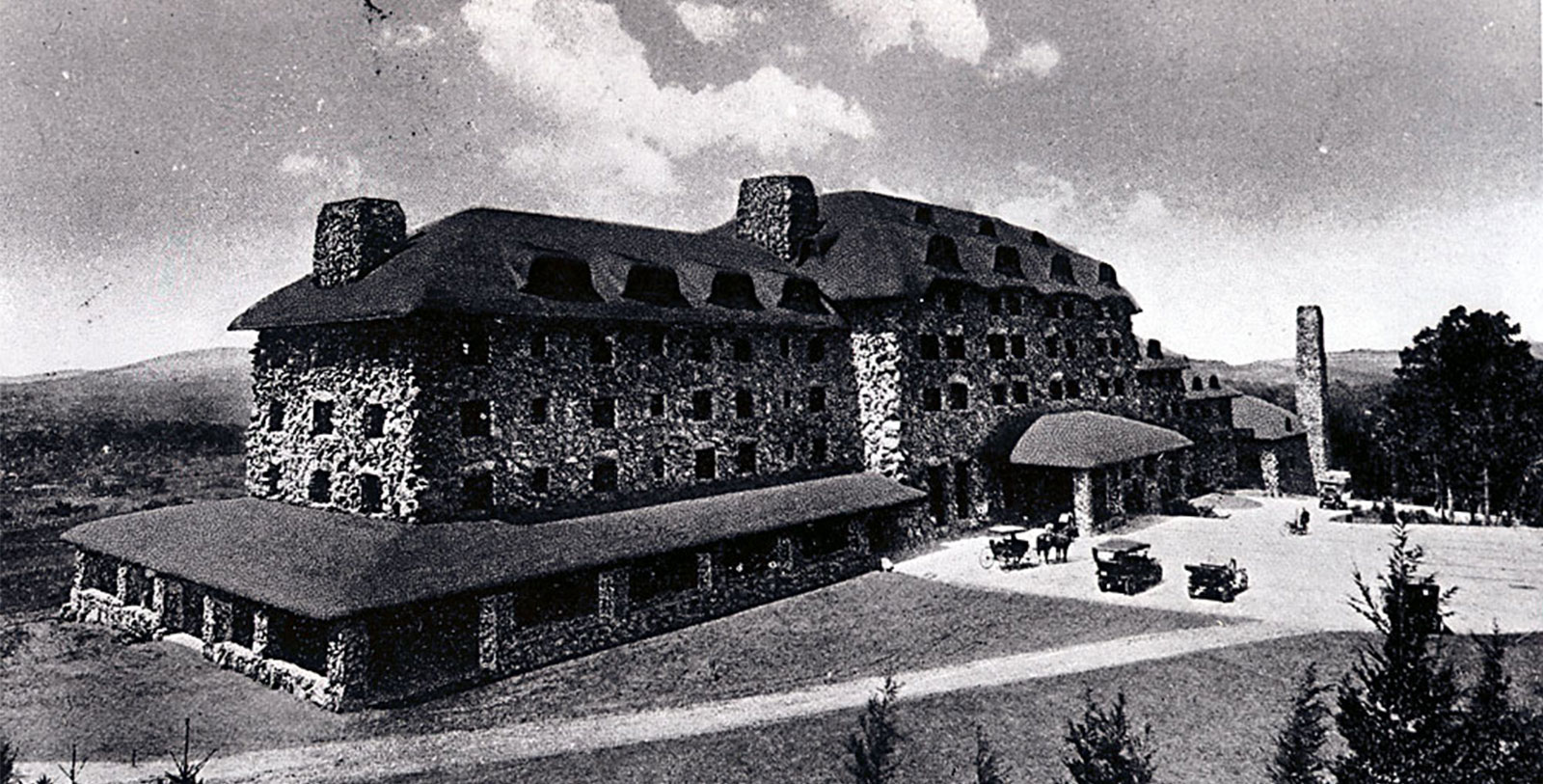 a large stone building with a large roof