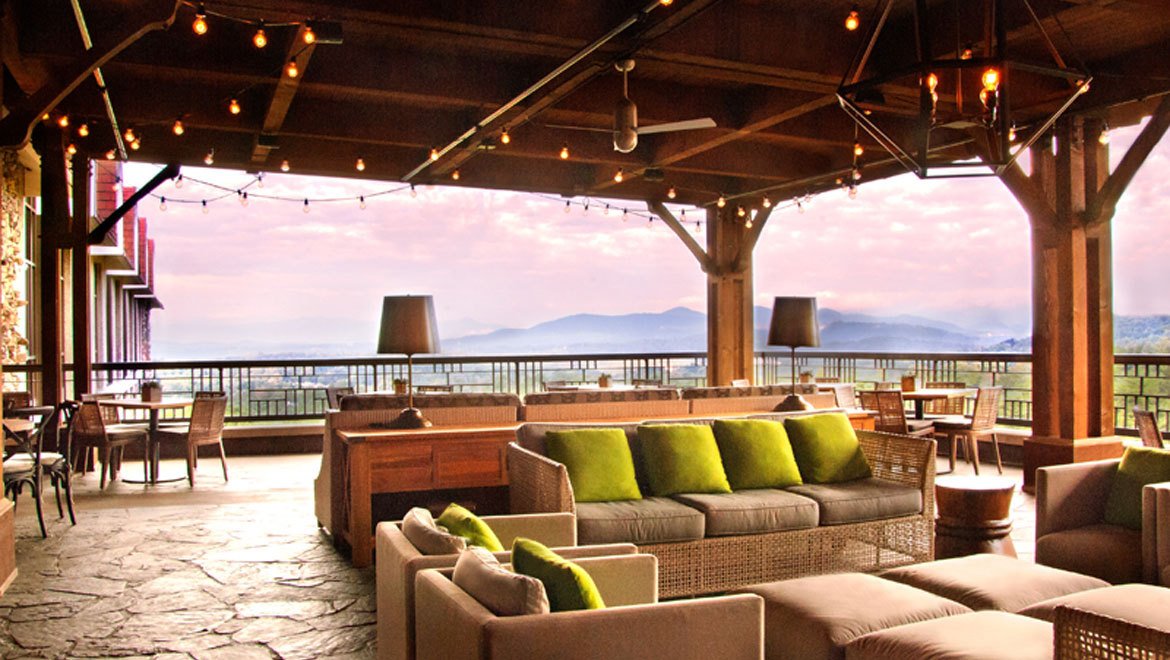 a patio with a view of the mountains
