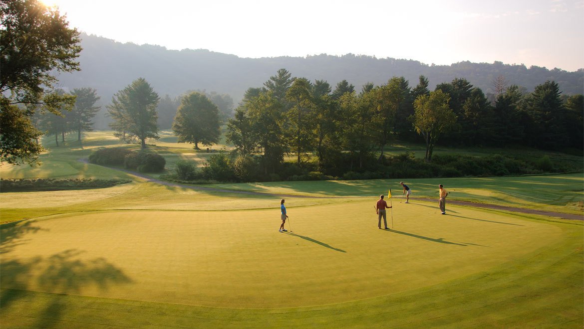 a group of people on a golf course