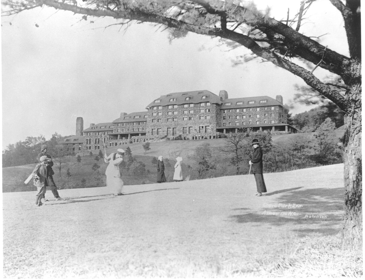 a group of people playing golf