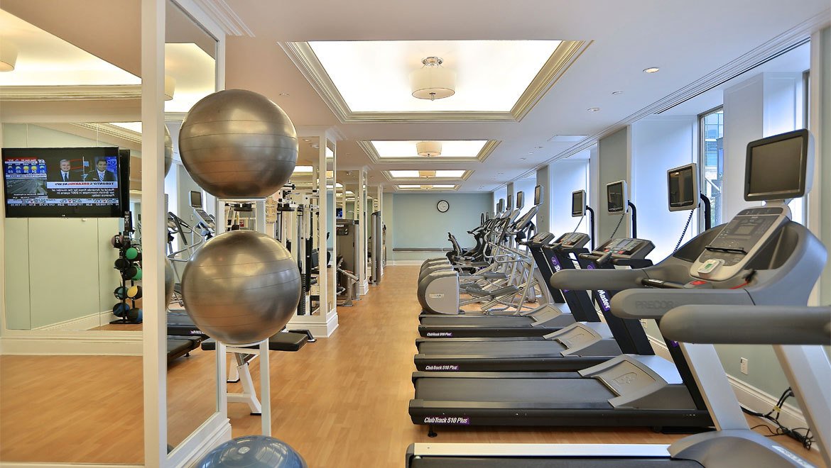 a room with treadmills and exercise equipment