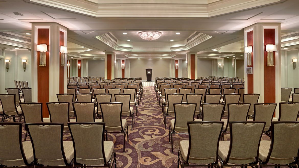 a room with rows of chairs