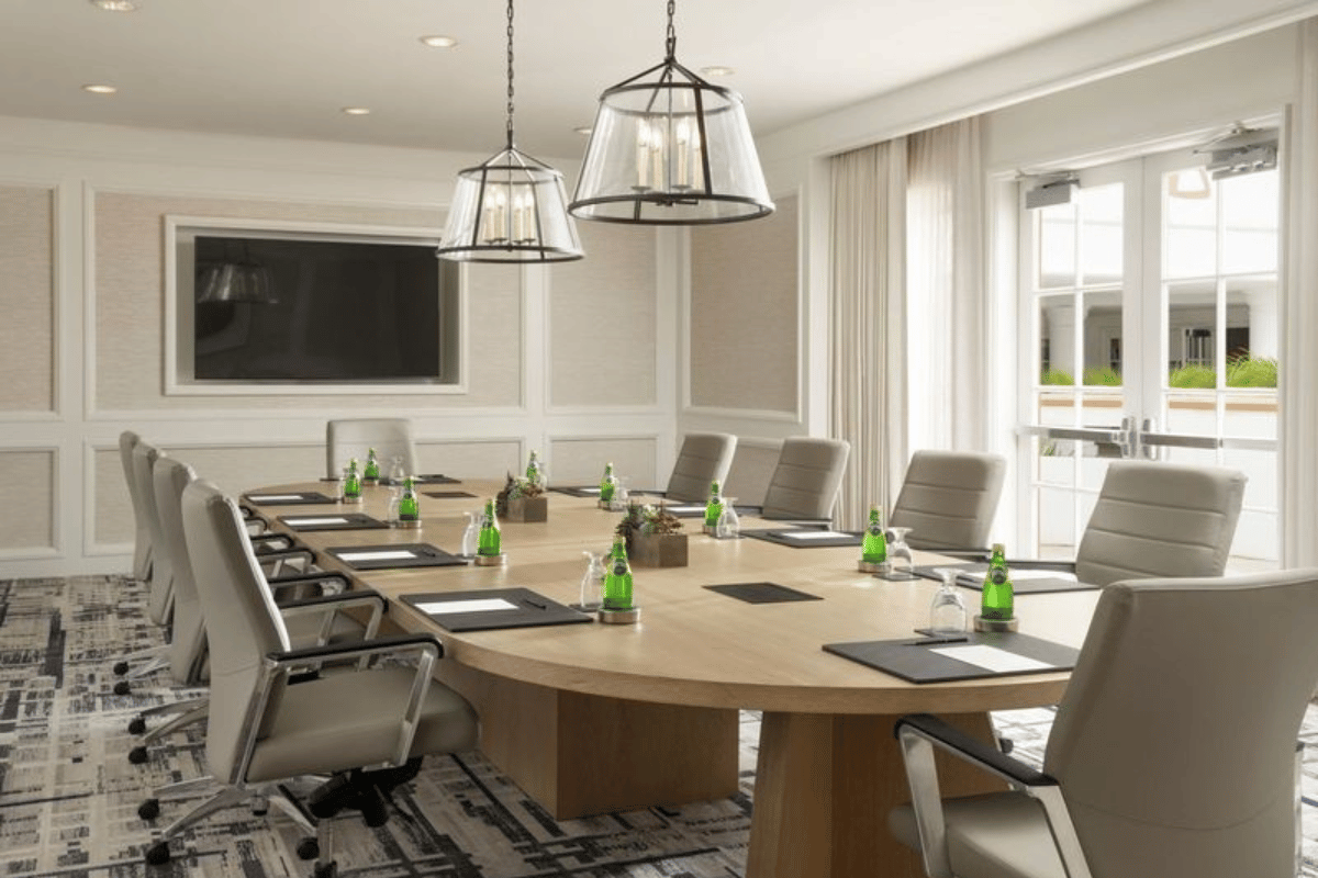 a conference room with a large table and chairs