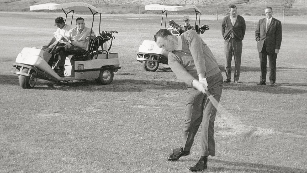 a man swinging a golf club