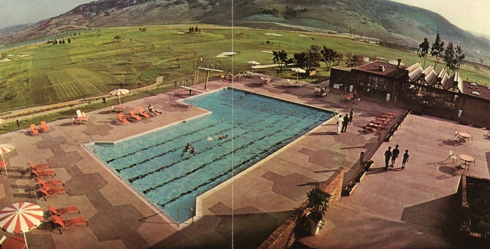 a swimming pool with people in it