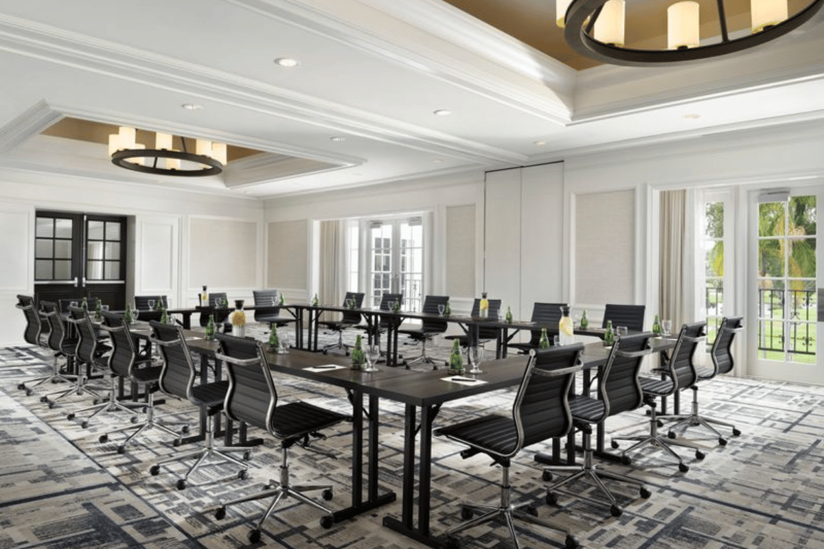 a room with a large table and chairs