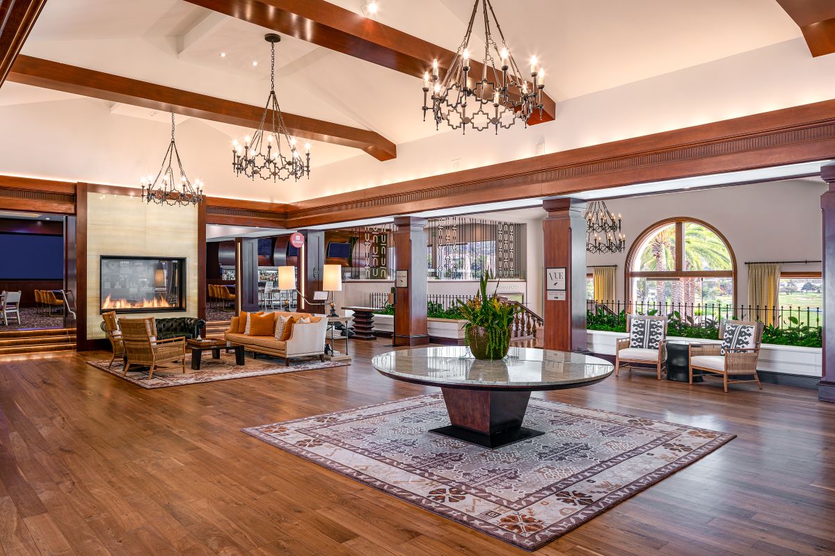 a large room with a fireplace and a large table