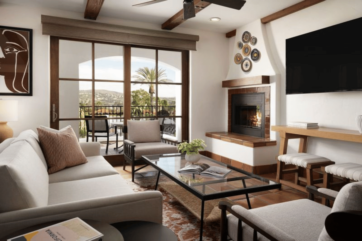 a living room with a fireplace and a couch