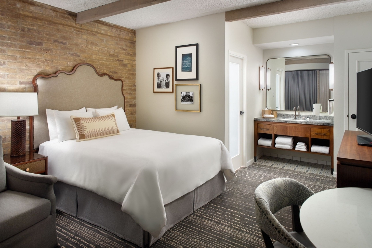 a room with a bed and a mirror