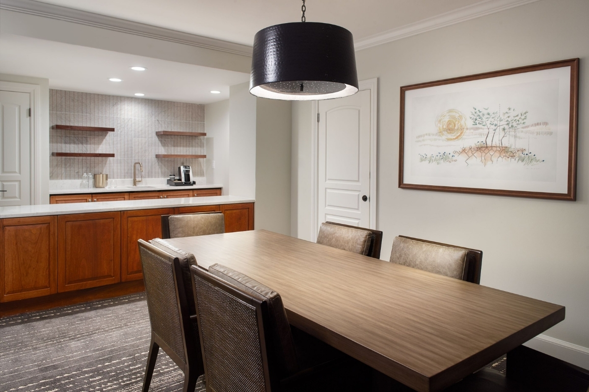 a dining room with a table and chairs