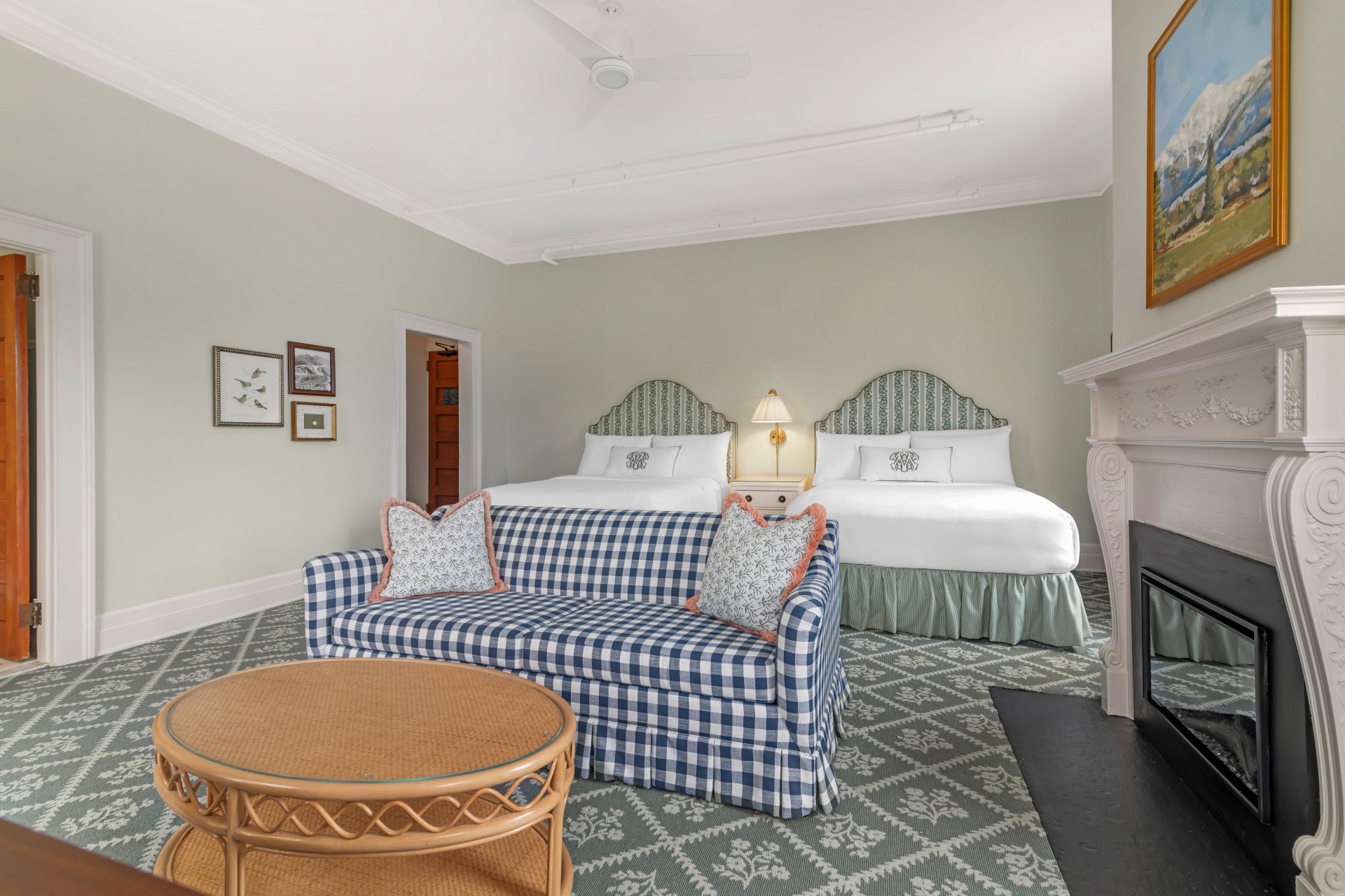 a room with two beds and a couch