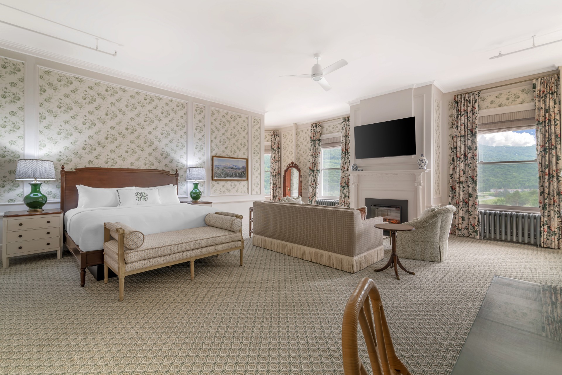 a room with a bed and a fireplace