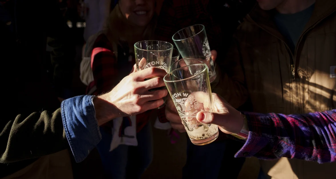 a group of people holding glasses