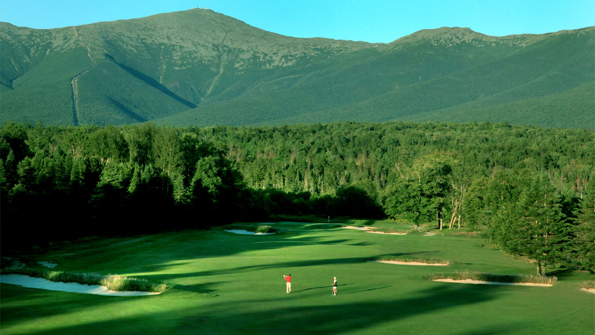 a group of people on a golf course