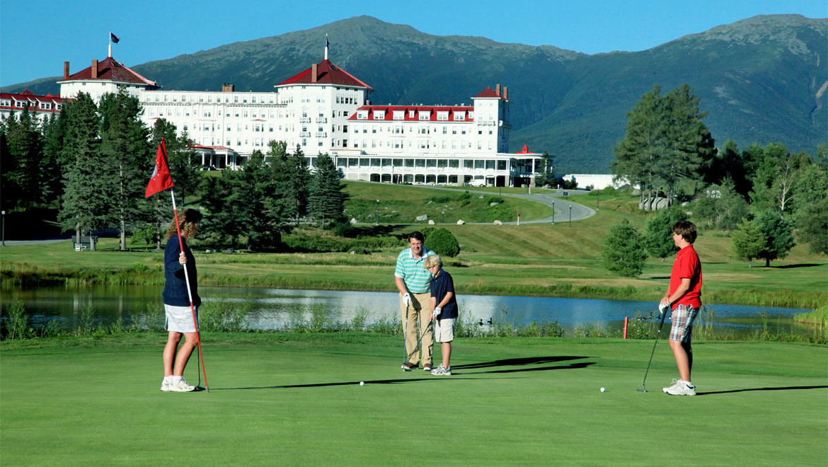 a group of people playing golf
