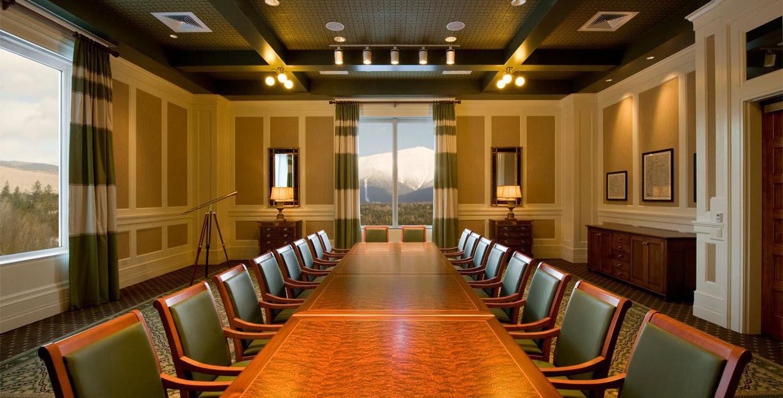 a conference room with a table and chairs