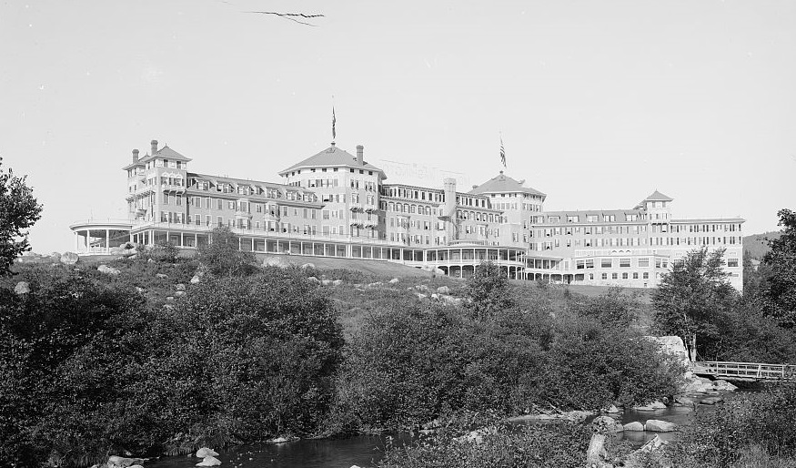 a large building with a flag on top