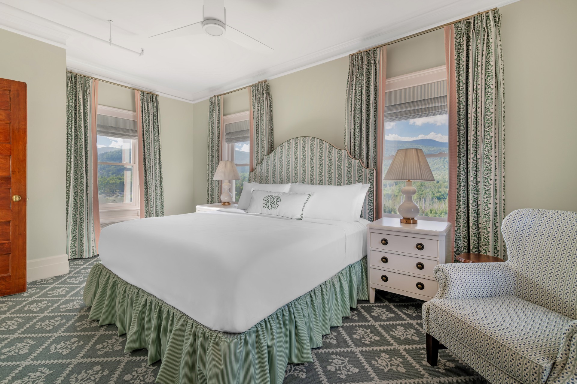 a bedroom with a bed and a chair