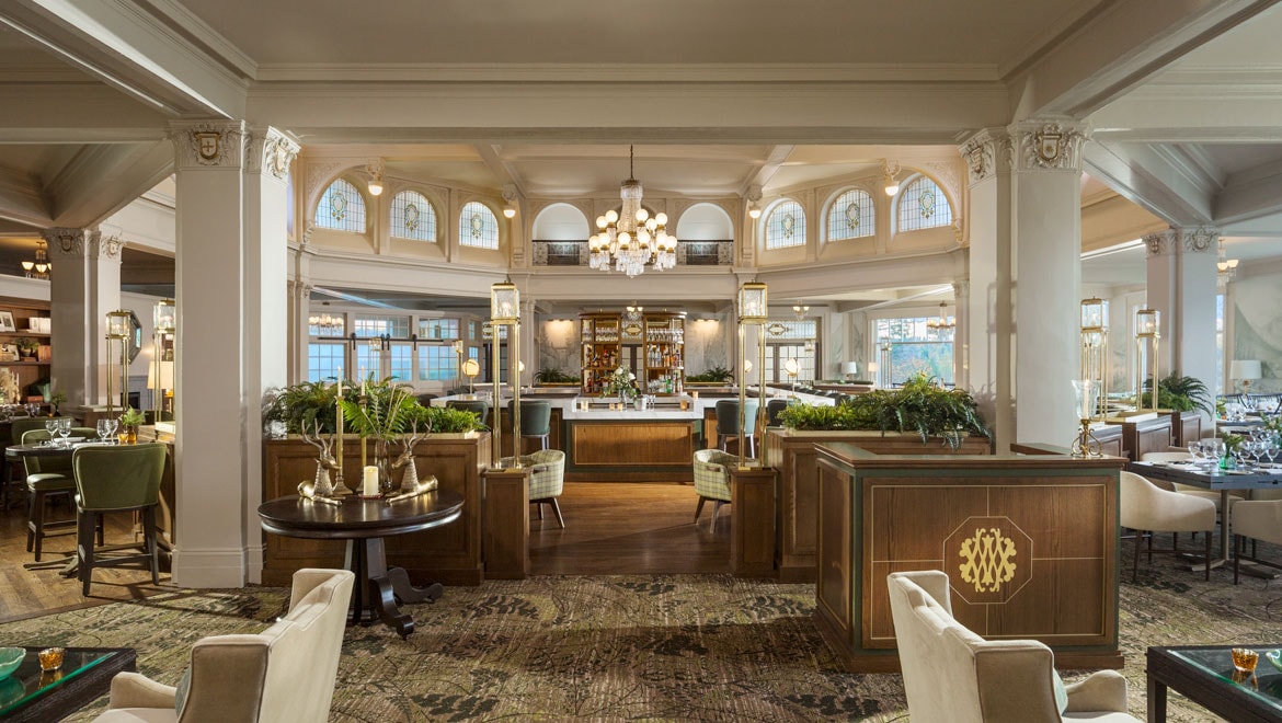 a room with a large table and chairs