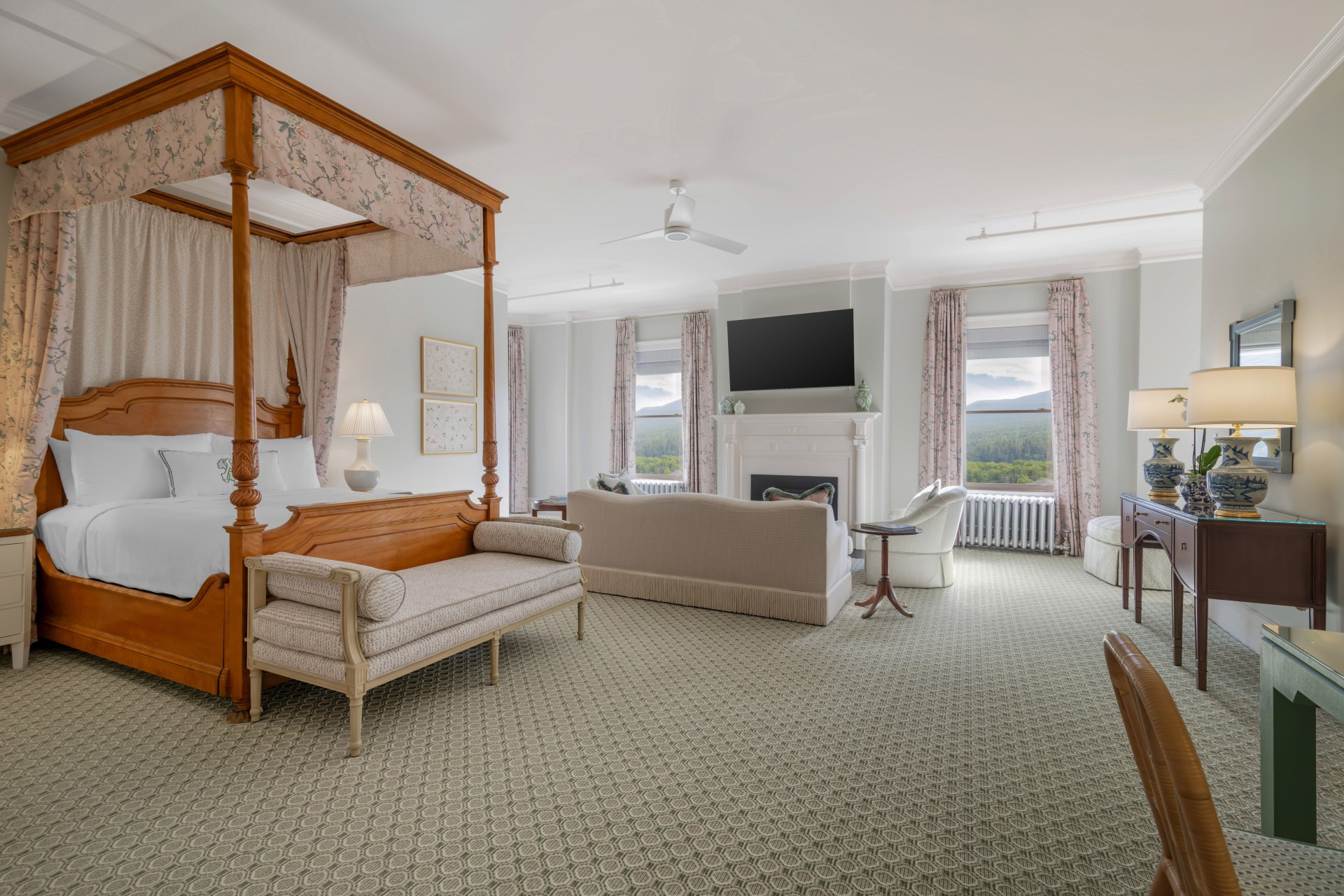 a room with a bed and couches