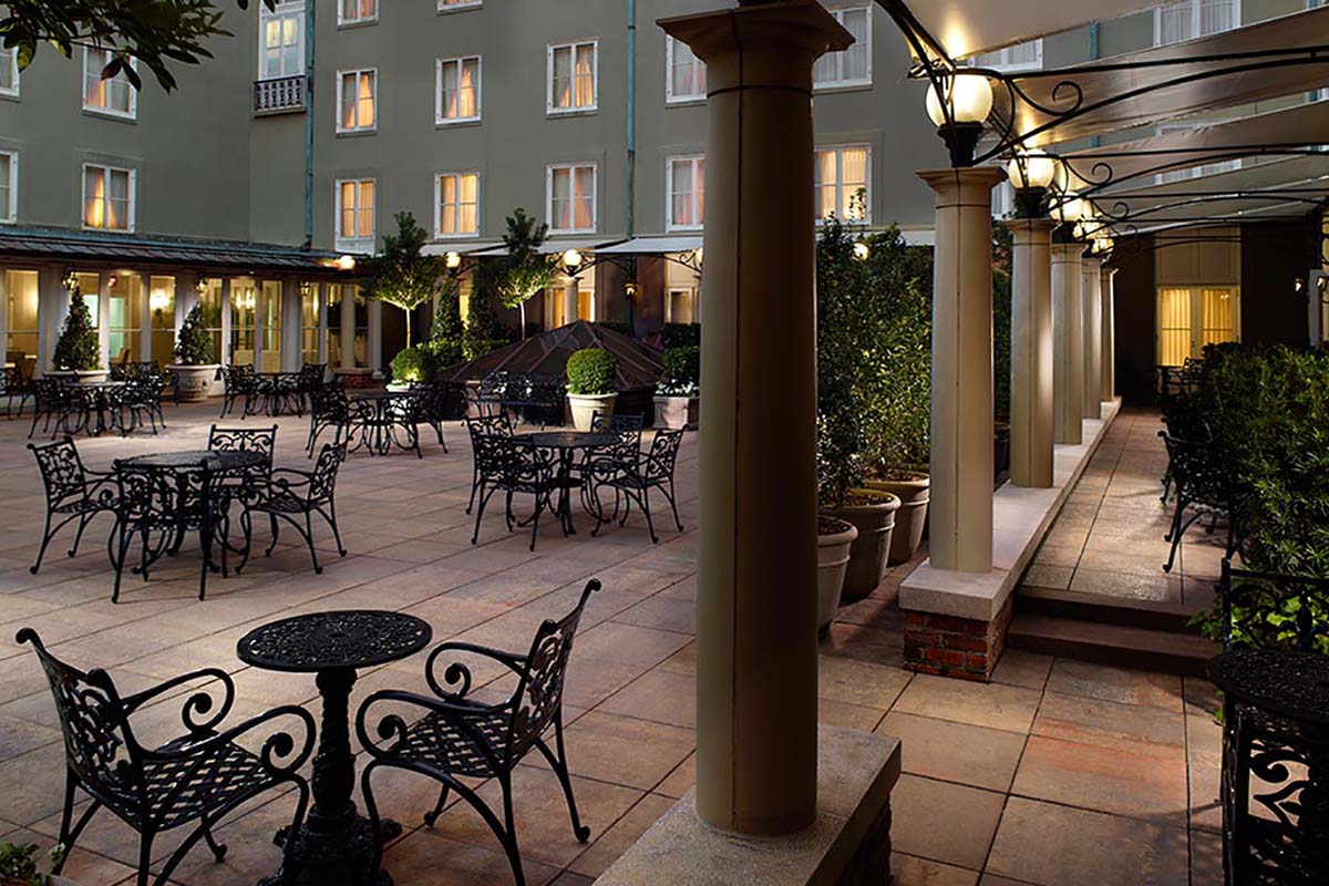 a patio with tables and chairs