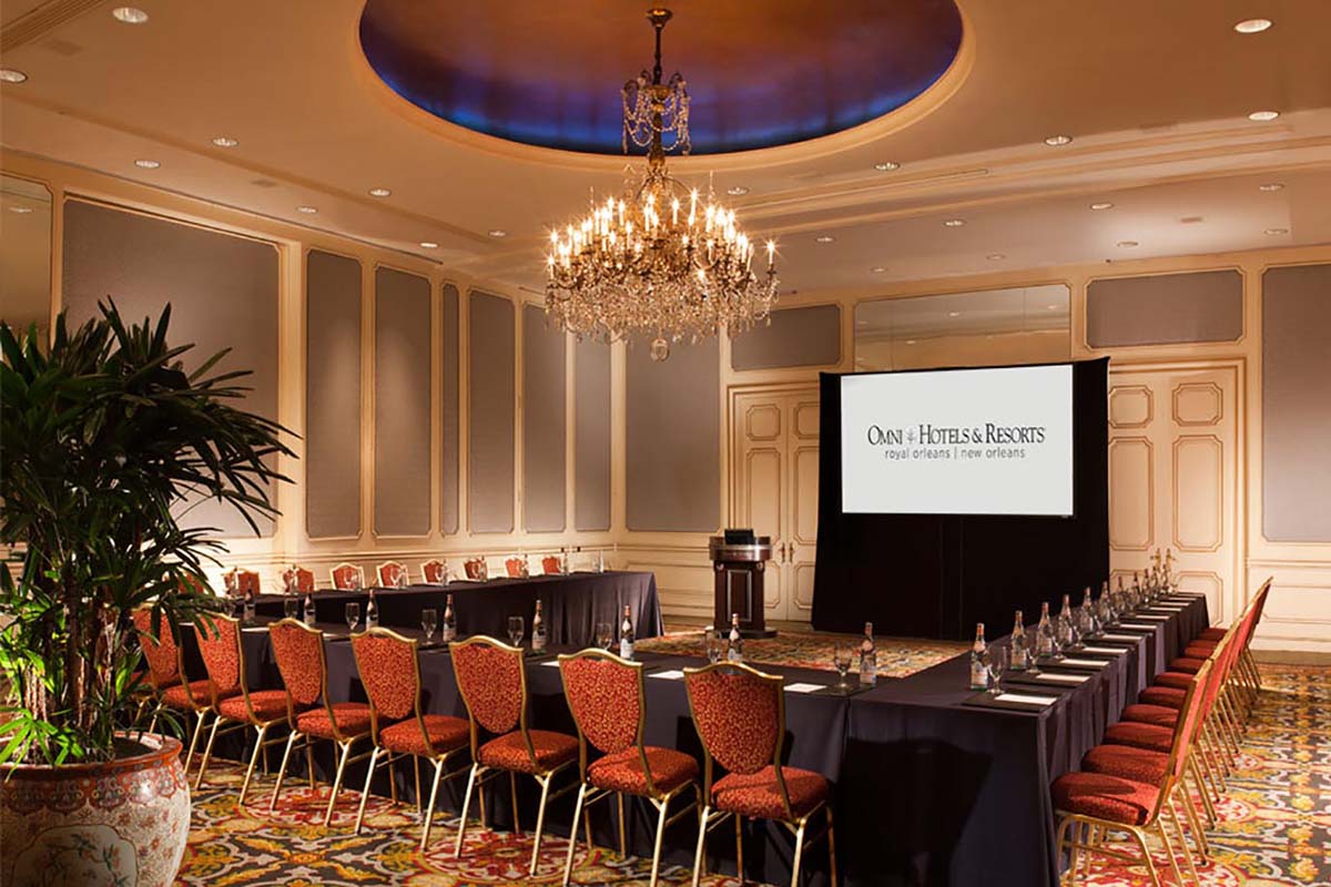 a long conference room with a large table and chairs