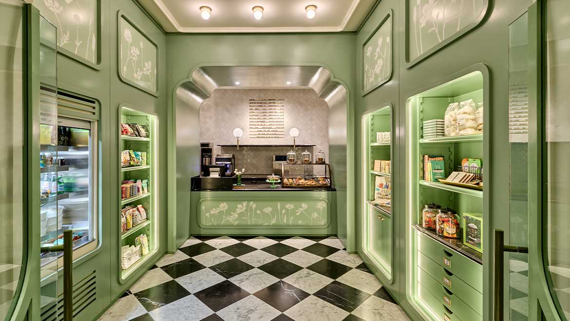 a green room with shelves and shelves