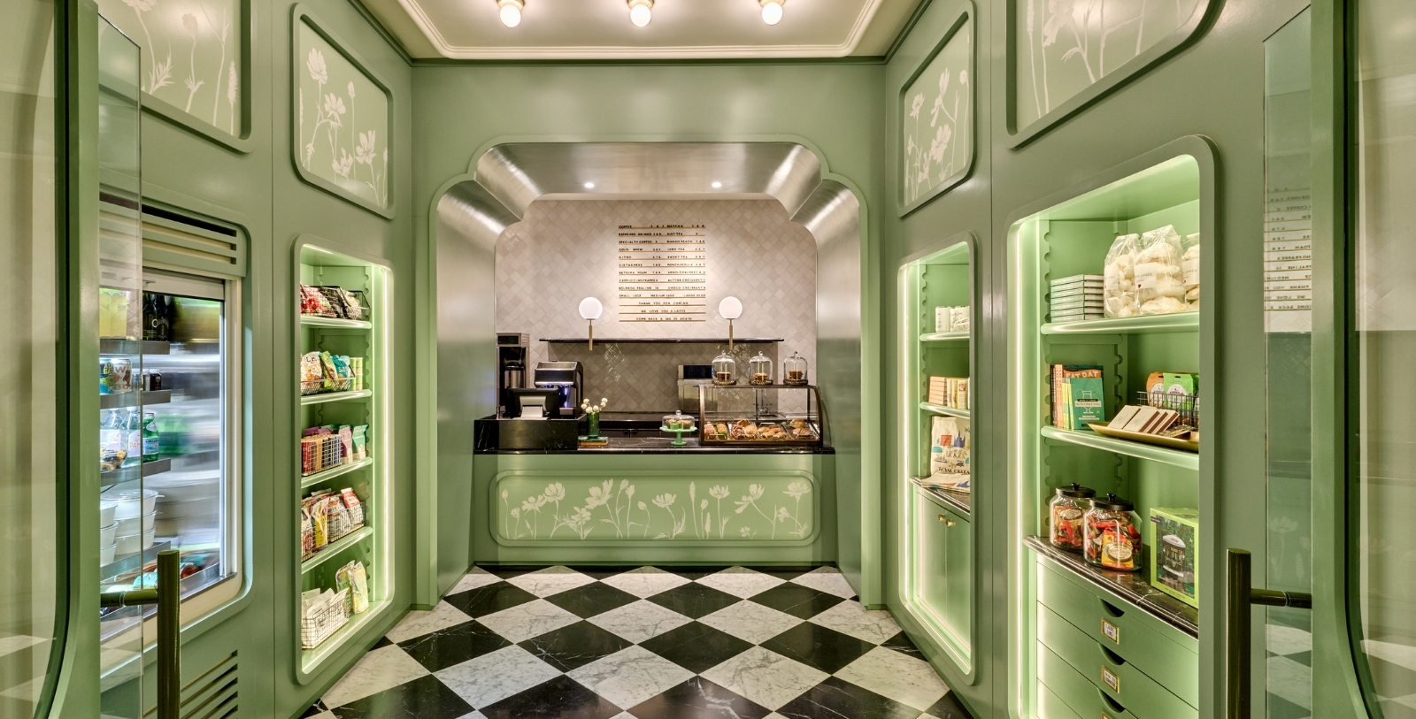 a green counter with shelves in a room